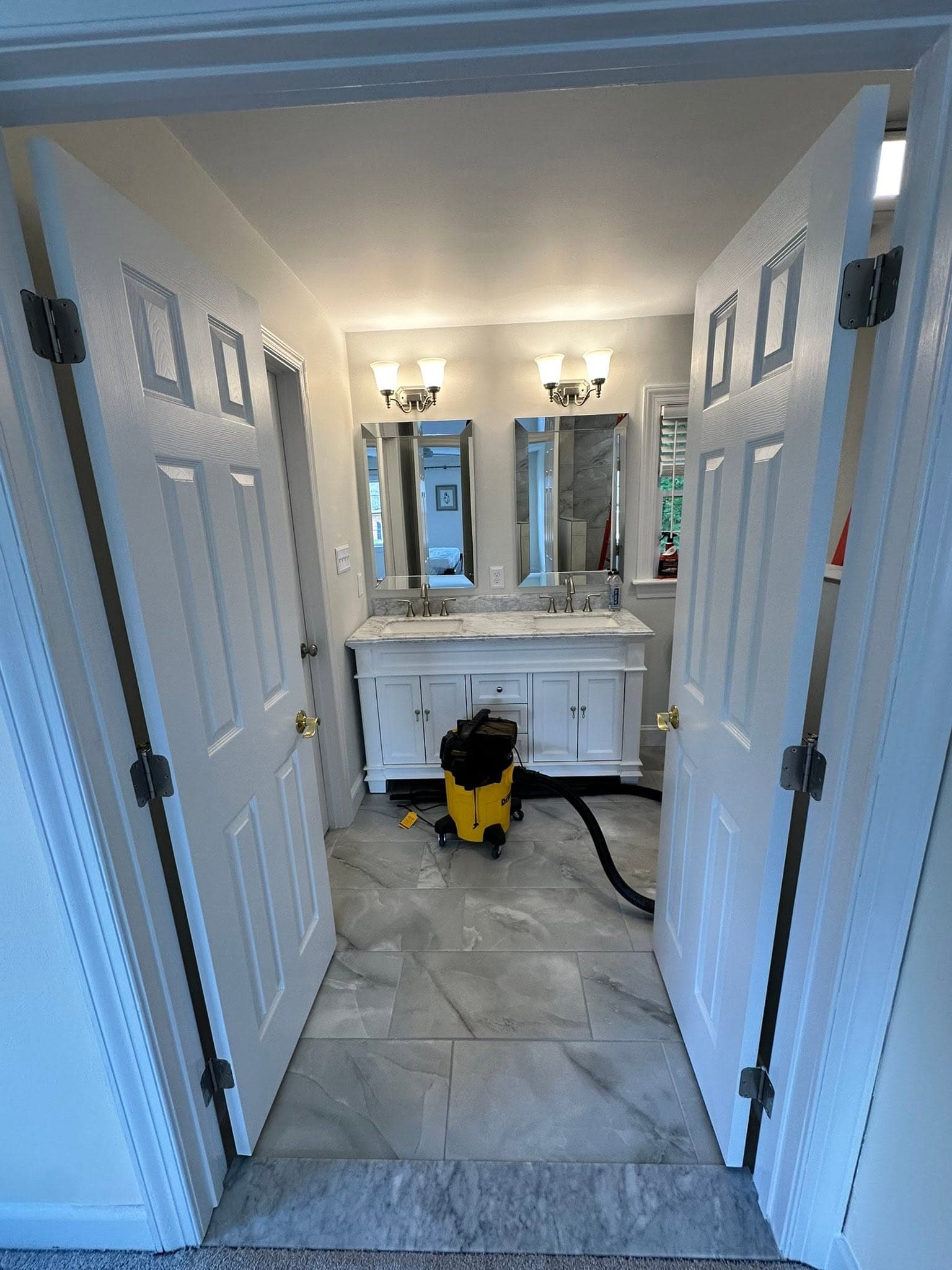 Bathroom remodel with marble double vanity completed by Newman's Plumbing near Suffolk, VA
